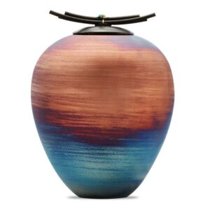 Raku ceramic urn with handcrafted artistic textures symbolizing peace, reflection, and lasting remembrance